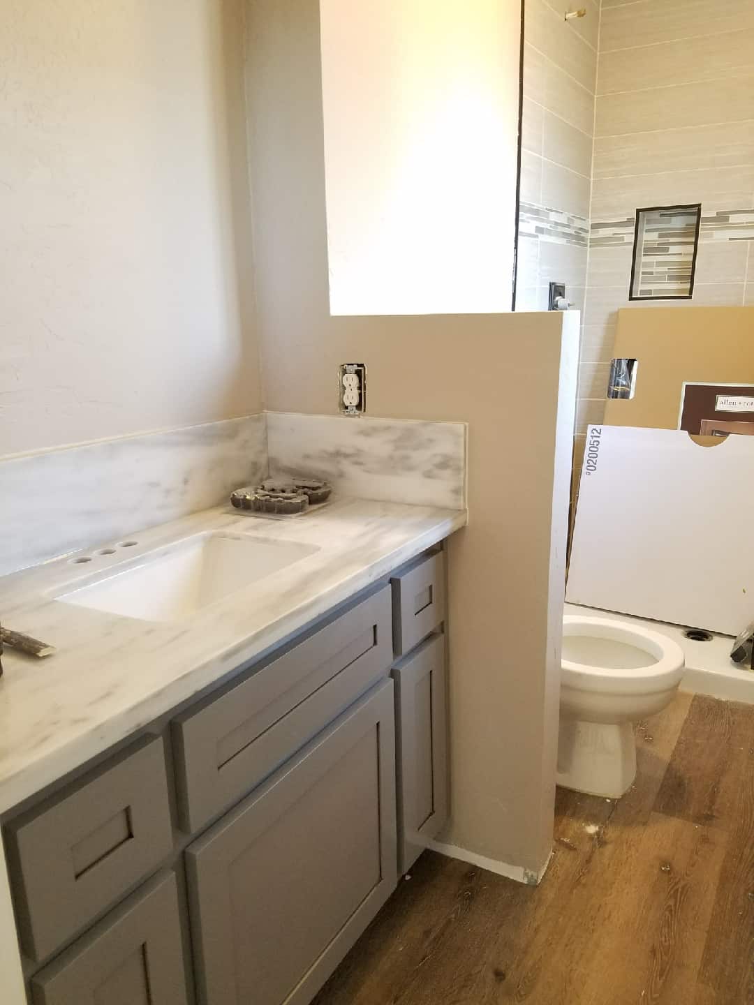 Remodeling a bathroom with a dividing wall to create privacy